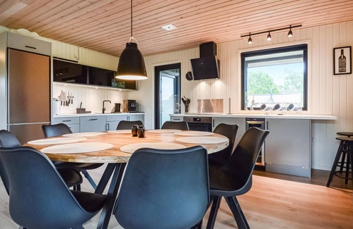 Hejlsminde Strand House | Quaint Wooden Retreat with Scenic Views and Garden Oasis