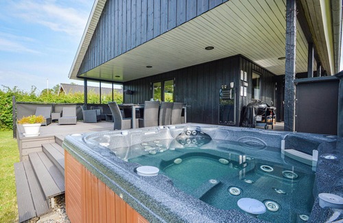 Hejlsminde Strand House | Quaint Wooden Retreat with Scenic Views and Garden Oasis