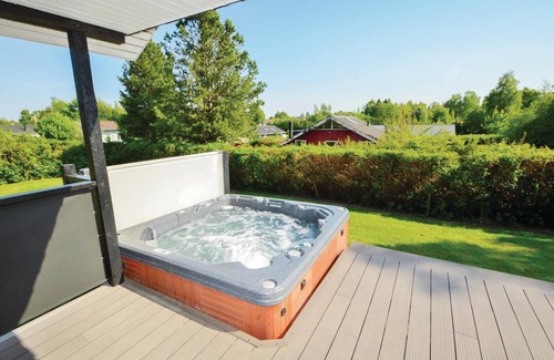 Hejlsminde Strand House | Quaint Wooden Retreat with Scenic Views and Garden Oasis