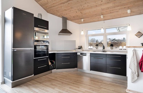 Pøt Strandby House | Atmospheric Oceanfront Vacation Home with Spa & Lake Views