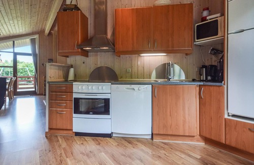 Skaven Strand House | Experience a Relaxing Vacation in This Cozy Log Cabin