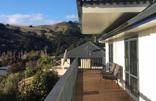 Akaroa House | Welcoming House: Bright Holiday Home with Pool & Parking
