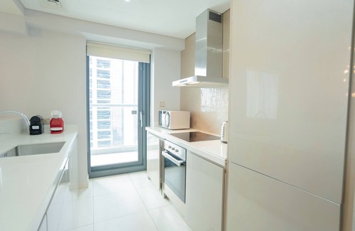 Business Bay Apartment | Discover Aya: Two Bedroom Retreat with Pool & Kitchen