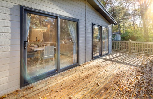 Weybourne Apartment | Experience Azenor Lodge: Pet-Friendly Retreat with Hot Tub
