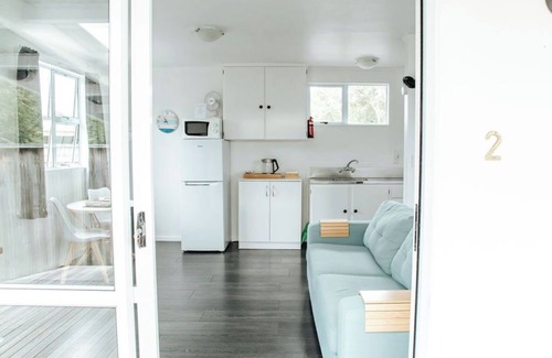 Lake Ferry Cottage | Pet-Friendly Bach 2: Lake Ferry Village Accommodation