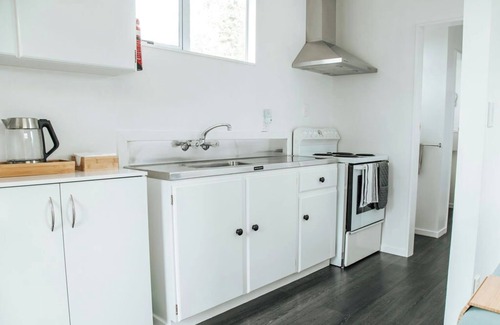 Lake Ferry Cottage | Pet-Friendly Bach 2: Lake Ferry Village Accommodation