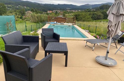 Baiona House | Relax in the Baiona Pool House with Family-Friendly Amenities