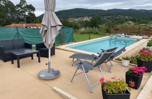 Baiona House | Relax in the Baiona Pool House with Family-Friendly Amenities