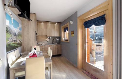 Livigno Apartment | Relaxing Baita del Sole: Mountain View, Wi-Fi & Garden