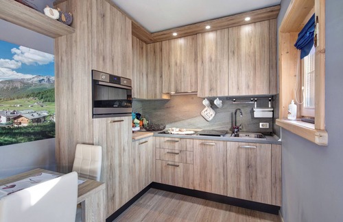 Livigno Apartment | Relaxing Baita del Sole: Mountain View, Wi-Fi & Garden