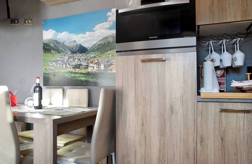 Livigno Apartment | Relaxing Baita del Sole: Mountain View, Wi-Fi & Garden