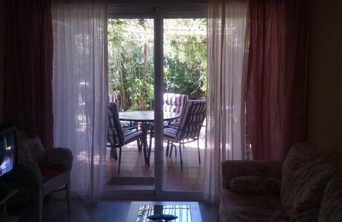 Islantilla Apartment | Charming Garden Retreat at Golf Islantilla for Families