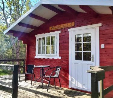 Hauganes Apartment | Cozy Bakkakot Cabin with Ocean View and Hot Tub