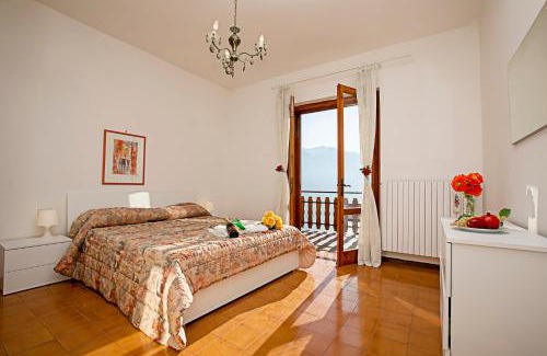 Voltino Apartment | Scenic Retreat at Balcone Panoramico sul Garda - Happy Rentals