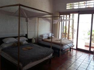 Cua Can Village Resort | Inviting Bamboo Cottages: Oceanfront Retreat with Pool