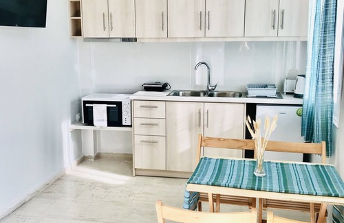 Roda Apartment | Relax in Banos Apartment with Pool Steps from the Beach