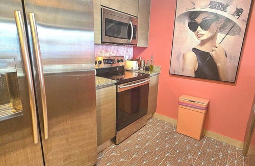 Edgewater Condo | BarB&B A Pink Paradise Awaits