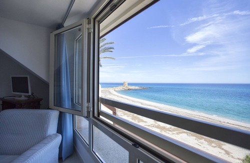 Torre di Bari Apartment | Beachfront Penthouse Retreat in Barisardo with Ocean View