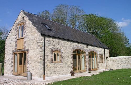 Littlebredy House | Relaxing Barn Conversion with Heated Pool and Ocean Views