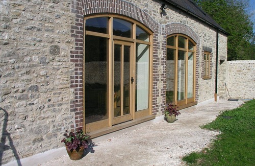 Littlebredy House | Relaxing Barn Conversion with Heated Pool and Ocean Views
