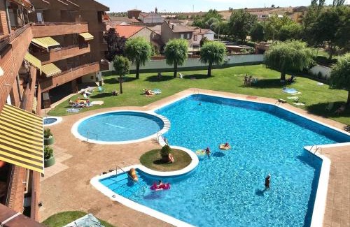 Villamanan Apartment | Explore BaruHaus: Duplex with Pool & Pet-Friendly Amenities