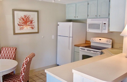 Treasure Island Apartment | Bayfront 2 Bedroom Retreat with Dock and Beach Access