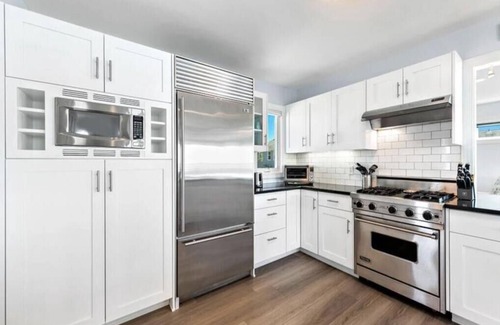 North Beach House | Relax at Bayfront North Beach with Pool & Spa Amenities