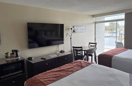 Trailer Estates Hotel | Bayview Waterfront Room with Pool, Tiki Bar & Grill Awaits