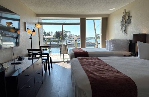 Trailer Estates Hotel | Bayview Waterfront Room with Pool, Tiki Bar & Grill Awaits