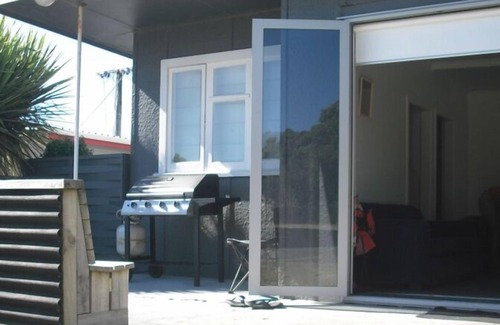 Urenui House | Beachfront Retreat in Urenui with Pool & Family-Friendly Perks