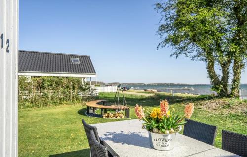 Grønninghoved Strand House | Oceanfront Home in Sjølund with Kitchen & Ocean Views