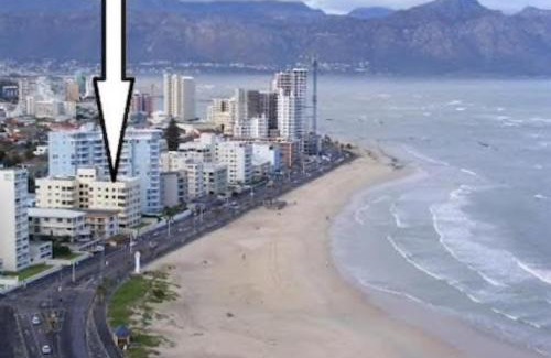 Strand Apartment | Beachfront Oasis with Ocean View and Pool - 4-Star Rated