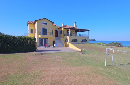 Pyrgos Apartment | Oceanfront Two-Bedroom Apartment with Breakfast Included