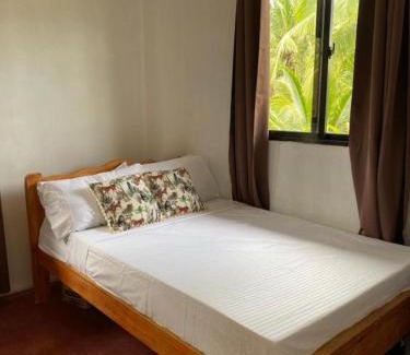 Bayawan City Bed & Breakfast | Cozy Beach House with Oceanfront Views and Private Access