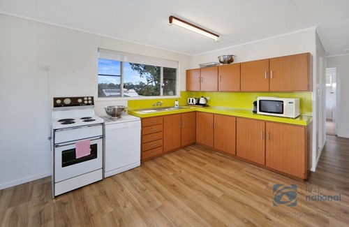 Woodgate House | Beach House Escape! Highset holiday Home one street from the Beach.
