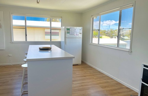 Woodgate House | Beach House Escape! Highset holiday Home one street from the Beach.