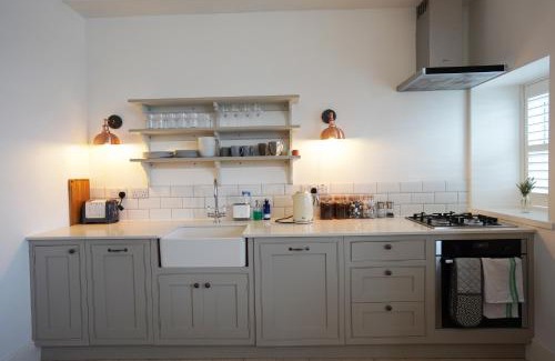 Fairlie Apartment | Coastal Retreat with Private Garden & Breathtaking Views
