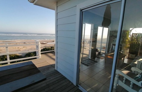Cannon Rocks Apartment | Seaside Retreat on Golden Sand Dunes with Ocean View