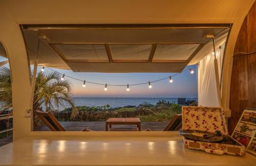 Aewol Apartment | Relax at BeachBoys - Retro Caravan Airstream with Ocean Views