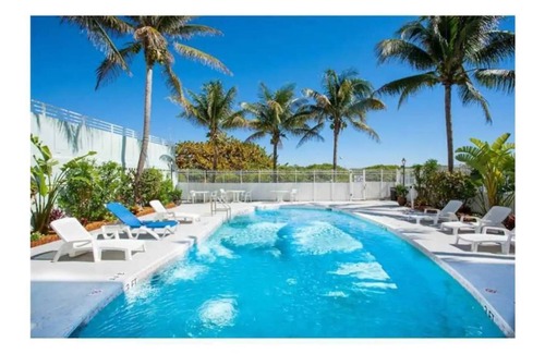 South of Fifth Apartment | Ocean View Retreat in Art Deco District with Pool & Perks