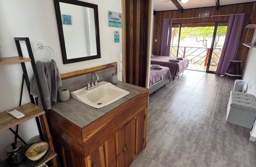 Esterillos Centro Hotel | Beachfront Escape in Esterillos Centro - Pool, A/C, WiFi & Private Rooms