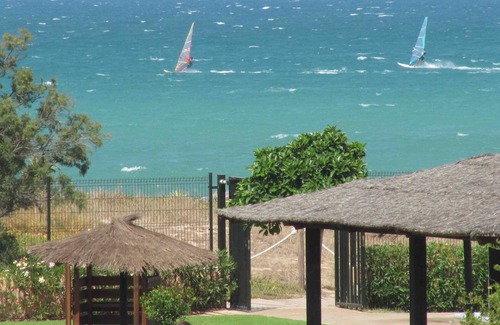 Almadrava Beach Apartment | Oceanfront Retreat with Private Pool and Spa Access