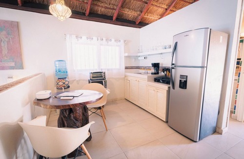 Isla Mujeres Cottage | Beachfront Palapa Cottage with Heated Pool & Tropical Gardens