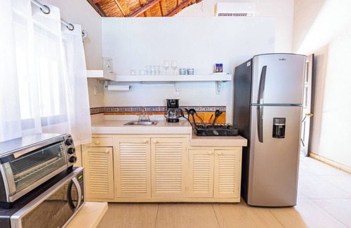 Isla Mujeres Cottage | Beachfront Palapa Cottage with Heated Pool & Tropical Gardens