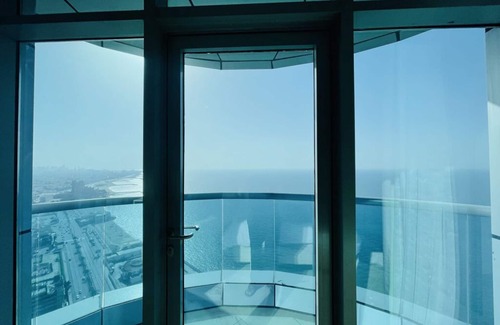 Rumailah Condo | Beachfront Retreat Near Dubai with Ocean View & Spa Access
