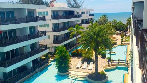 Cha-am Apartment | Beachfront Apartment with Pool, Balcony & Ocean Views