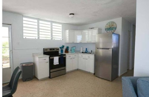 Puerto Nuevo Apartment | Beachside Retreat Steps from the Shore with Spa & Breakfast