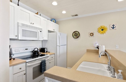 Traverse City Condo | Beachside Haven 102 Beachfront Condo