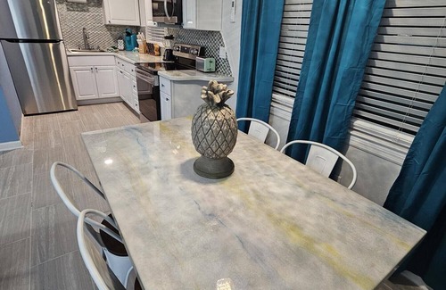 Caloosahatchee Apartment | Convenient Getaway: Walk to Town & Enjoy Ocean Views!