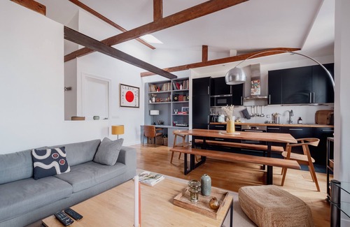 Clignancourt Apartment | Explore Beams and Dreams with Spa, Kitchen & Family Options